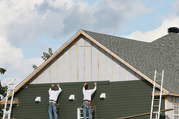 Professional Storm Damage Siding Repair technician working in Reynoldsburg, OH